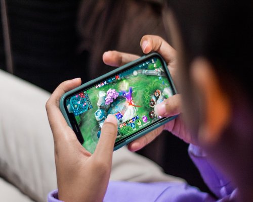 Mobile gaming demonstration shown on a smartphone screen during a technology showcase